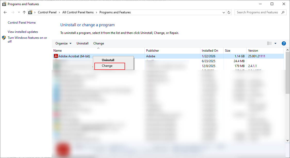 Right-click Adobe Acrobat in Programs and Features and select the Change option