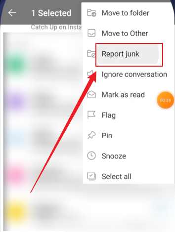 Tap the Report junk option in the Outlook app on iPhone